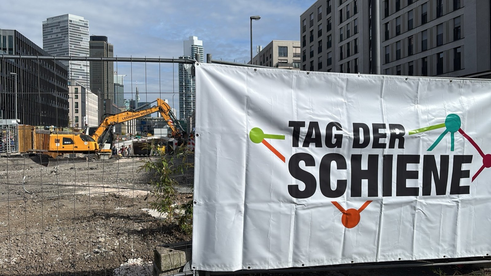 Tag der Schiene banner on a construction site fence